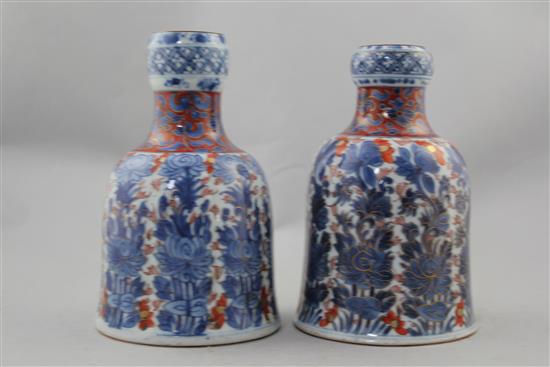 Two Chinese underglaze blue and iron red enamelled bell shaped huqqa bases, Kangxi period, 18cm. and 18.5cm.